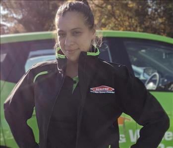 SERVPRO of Middletown shares picture of one of their female project managers standing in front of their SERVPRO vehicle.